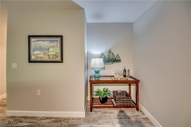 9470 Ivy Brook Run Unit 803, Fort Myers, FL 33913 - hall with wood finished floors and baseboards
