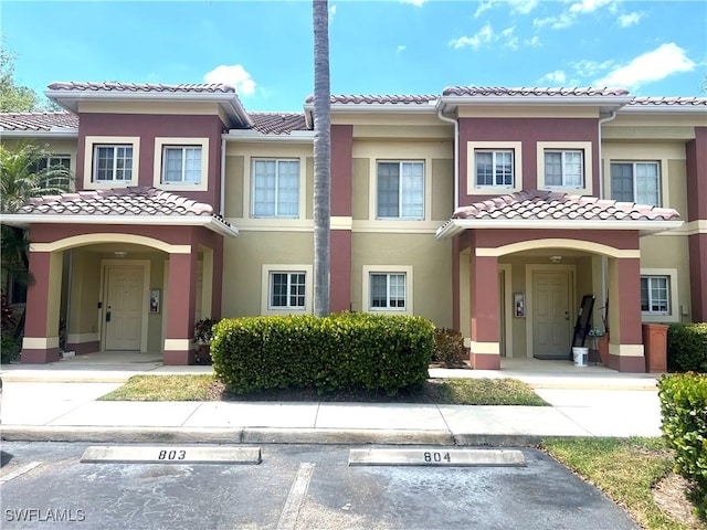 9470 Ivy Brook Run Unit 803, Fort Myers, FL 33913 - multi unit property with a tile roof, uncovered parking, and stucco siding