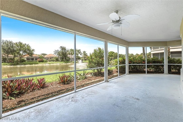 3082 Windsong Ct Unit 303, Naples, FL 34109 - unfurnished sunroom with a water view and a ceiling fan