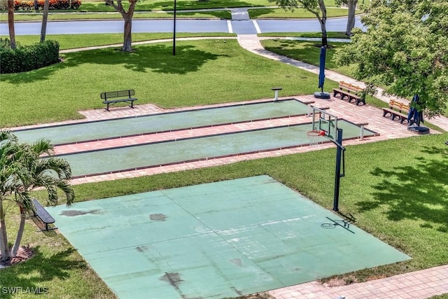 3082 Windsong Ct Unit 303, Naples, FL 34109 - view of community featuring a bocce ball area and a lawn