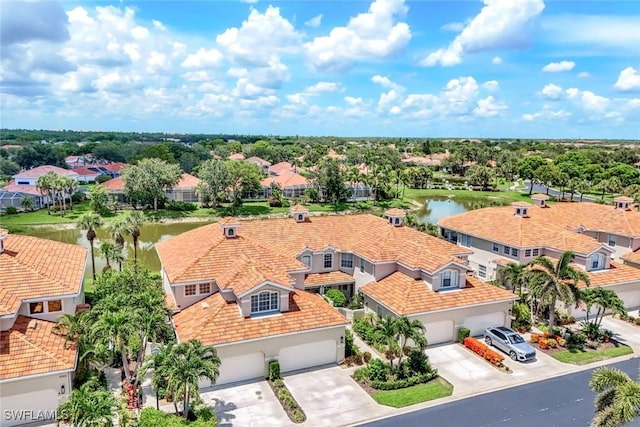 3082 Windsong Ct Unit 303, Naples, FL 34109 - aerial perspective of suburban area with a large body of water