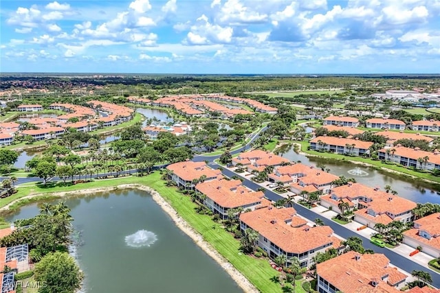 3082 Windsong Ct Unit 303, Naples, FL 34109 - aerial perspective of suburban area with a large body of water