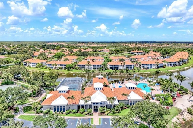 3082 Windsong Ct Unit 303, Naples, FL 34109 - drone / aerial view of a large body of water and a pool area