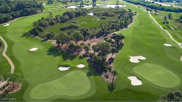 9051 Leatherwood Loop, Lehigh Acres, FL 33936 - aerial view of property and surrounding area featuring a golf club and a nearby body of water