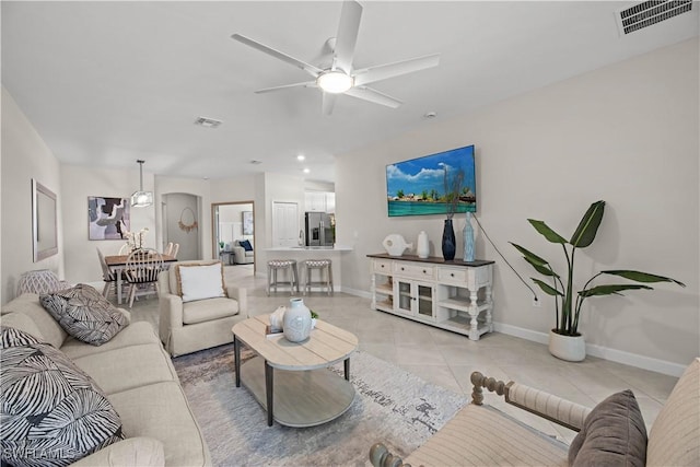 9051 Leatherwood Loop, Lehigh Acres, FL 33936 - living area with light tile patterned floors, ceiling fan, and recessed lighting