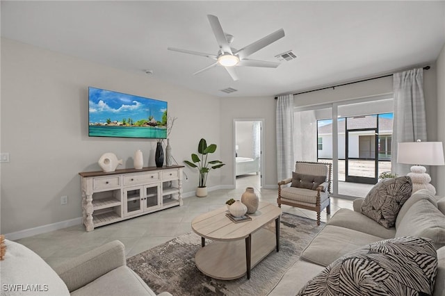 9051 Leatherwood Loop, Lehigh Acres, FL 33936 - living room with a ceiling fan and light tile patterned floors