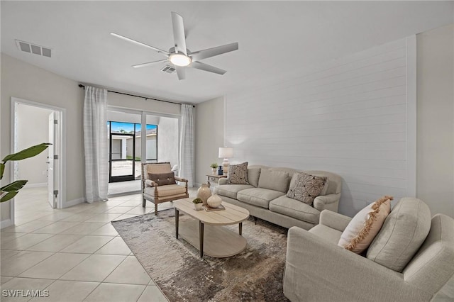 9051 Leatherwood Loop, Lehigh Acres, FL 33936 - living room featuring light tile patterned floors and a ceiling fan