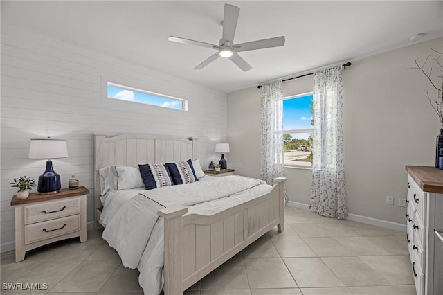 9051 Leatherwood Loop, Lehigh Acres, FL 33936 - bedroom featuring light tile patterned floors, ceiling fan, and a skylight