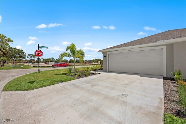 9051 Leatherwood Loop, Lehigh Acres, FL 33936 - garage featuring driveway