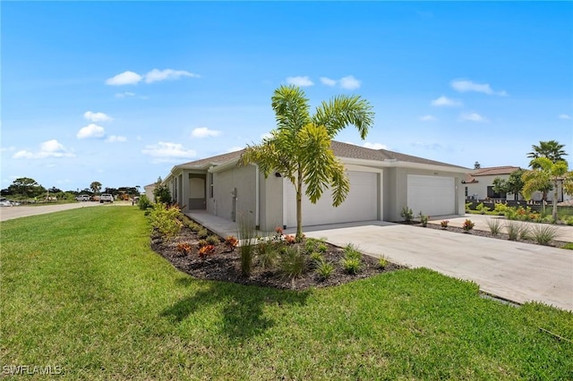 9051 Leatherwood Loop, Lehigh Acres, FL 33936 - view of home's exterior featuring a garage, stucco siding, a yard, and driveway