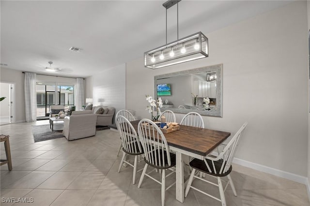 9051 Leatherwood Loop, Lehigh Acres, FL 33936 - dining space featuring light tile patterned floors and ceiling fan