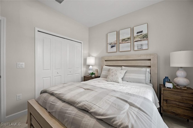 9051 Leatherwood Loop, Lehigh Acres, FL 33936 - bedroom featuring a closet and baseboards