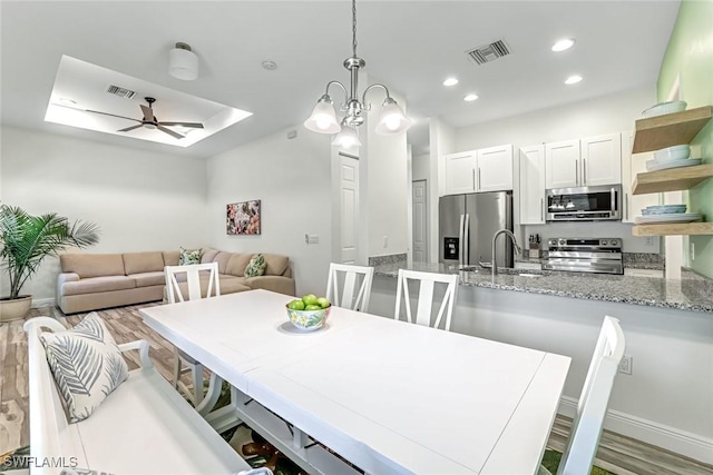3980 Full Moon Ct, Naples, FL 34112 - dining space featuring ceiling fan, recessed lighting, and wood finished floors