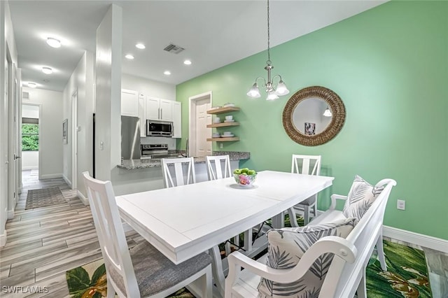 3980 Full Moon Ct, Naples, FL 34112 - dining area with a chandelier, light wood-type flooring, and recessed lighting