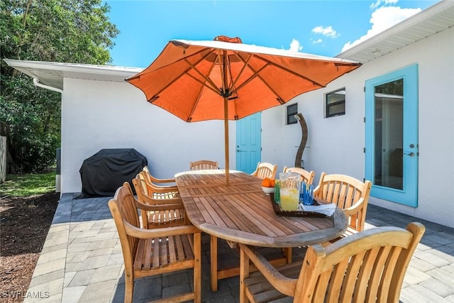 3980 Full Moon Ct, Naples, FL 34112 - view of patio with area for grilling and outdoor dining area