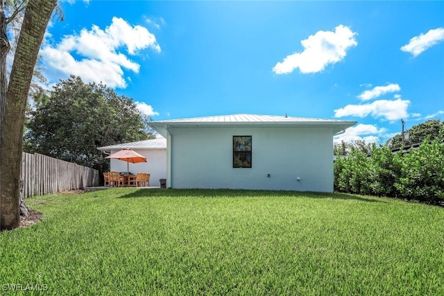 3980 Full Moon Ct, Naples, FL 34112 - back of property with a standing seam roof, a metal roof, and stucco siding