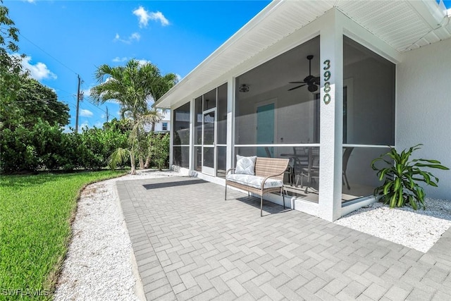 3980 Full Moon Ct, Naples, FL 34112 - view of patio featuring a sunroom