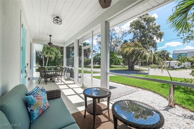 3980 Full Moon Ct, Naples, FL 34112 - sunroom / solarium featuring a ceiling fan and plenty of natural light