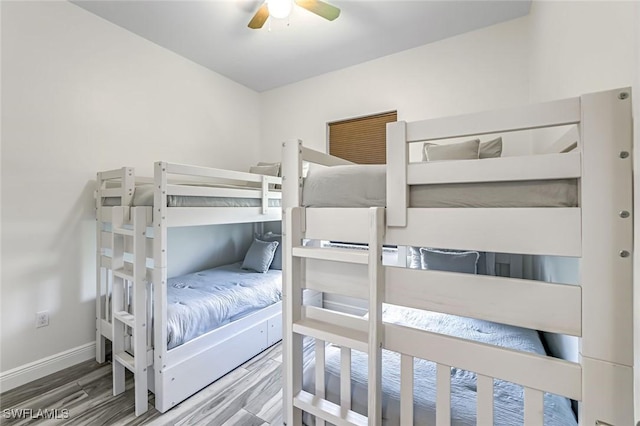 3980 Full Moon Ct, Naples, FL 34112 - bedroom with wood finished floors and a ceiling fan