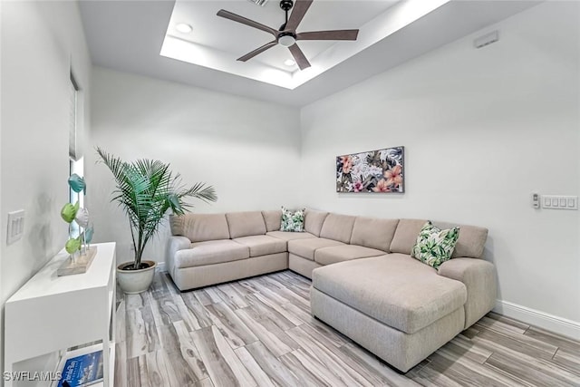 3980 Full Moon Ct, Naples, FL 34112 - living area with ceiling fan, wood finished floors, a tray ceiling, and recessed lighting