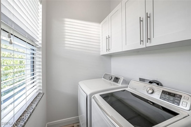 3980 Full Moon Ct, Naples, FL 34112 - laundry room featuring cabinet space and washer and clothes dryer