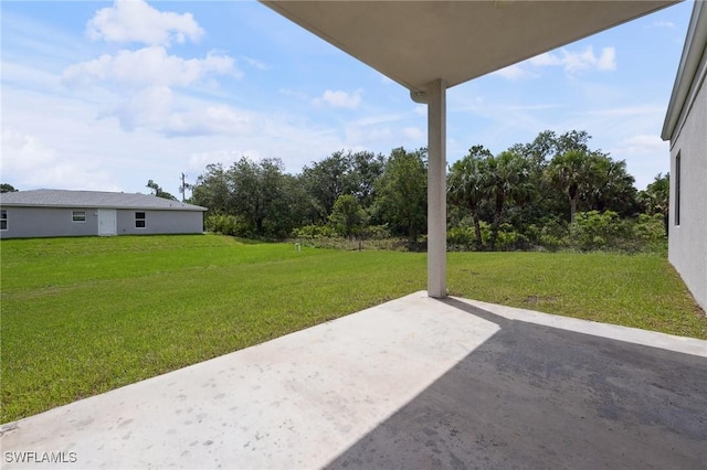 1836 Jacinto Ave, Lehigh Acres, FL 33972 - view of grassy yard featuring a patio