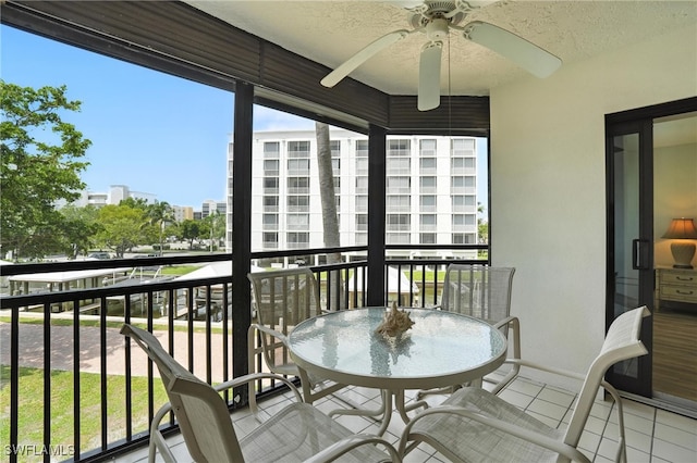 4265 Bay Beach Ln Unit 226, Fort Myers Beach, FL 33931 - balcony with ceiling fan and a city view