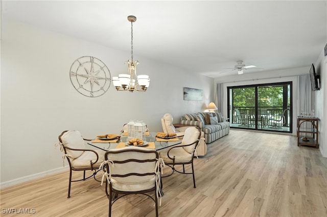 4265 Bay Beach Ln Unit 226, Fort Myers Beach, FL 33931 - dining space with light wood-type flooring, a chandelier, and ceiling fan