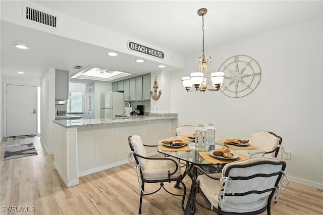 4265 Bay Beach Ln Unit 226, Fort Myers Beach, FL 33931 - dining space featuring light wood-style flooring, a chandelier, and recessed lighting