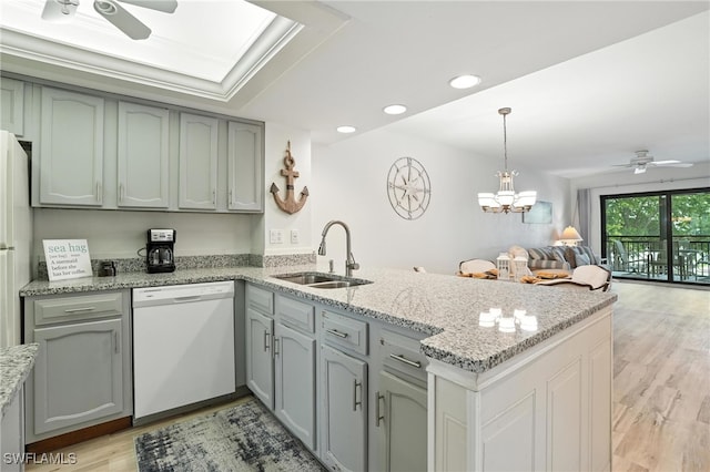 4265 Bay Beach Ln Unit 226, Fort Myers Beach, FL 33931 - kitchen with dishwasher, ceiling fan, a peninsula, open floor plan, and light wood finished floors