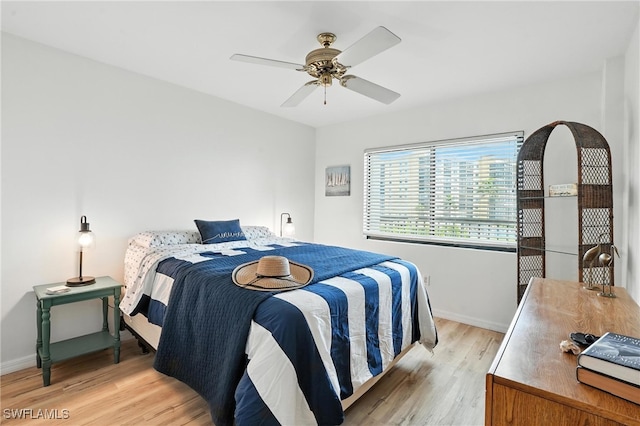 4265 Bay Beach Ln Unit 226, Fort Myers Beach, FL 33931 - bedroom featuring light wood-type flooring and a ceiling fan