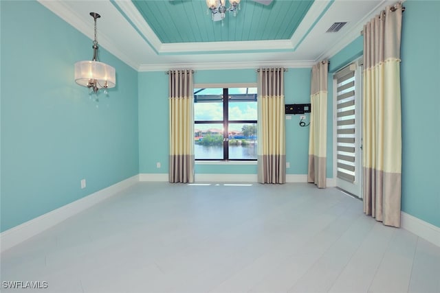 3309 SW 2nd Ln, Cape Coral, FL 33991 - unfurnished room with a raised ceiling, ornamental molding, a water view, and a chandelier