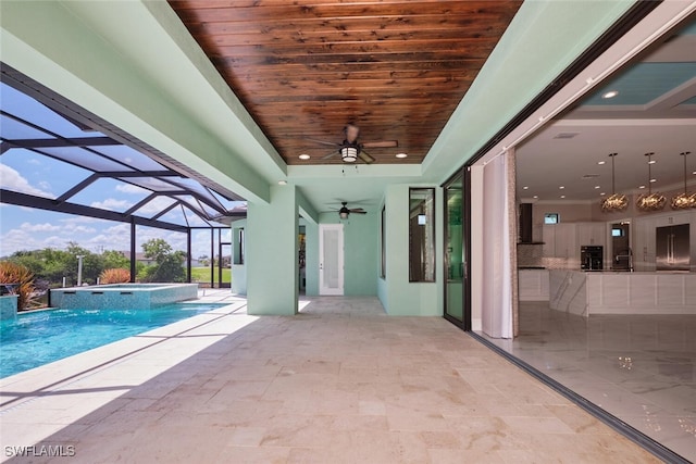 3309 SW 2nd Ln, Cape Coral, FL 33991 - view of pool featuring ceiling fan, a patio, a pool with connected hot tub, and a lanai