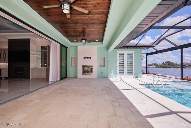 3309 SW 2nd Ln, Cape Coral, FL 33991 - view of patio featuring french doors, a ceiling fan, a water view, an outdoor pool, and glass enclosure