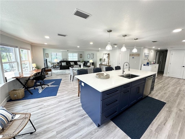 17921 Stevens Blvd, Fort Myers Beach, FL 33931 - kitchen with stainless steel dishwasher, ornamental molding, light wood-style flooring, light countertops, and healthy amount of natural light