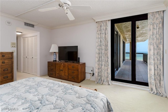 174 S Collier Blvd Unit 904, Marco Island, FL 34145 - bedroom featuring carpet flooring, crown molding, access to outside, a ceiling fan, and a textured ceiling