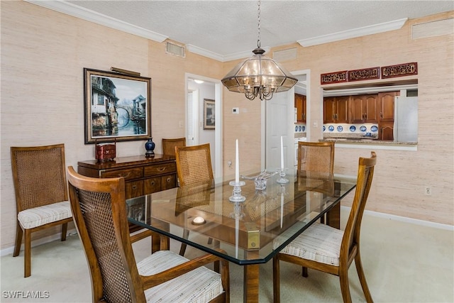 174 S Collier Blvd Unit 904, Marco Island, FL 34145 - dining room with a chandelier, crown molding, a textured ceiling, and light carpet