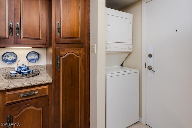 174 S Collier Blvd Unit 904, Marco Island, FL 34145 - laundry area featuring stacked washing machine and dryer
