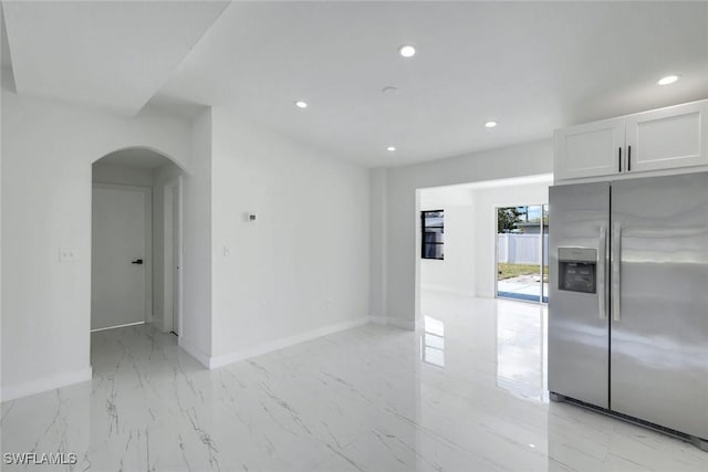 2118 Aldridge Ave, Fort Myers, FL 33907 - unfurnished room featuring arched walkways, light marble finish flooring, and recessed lighting