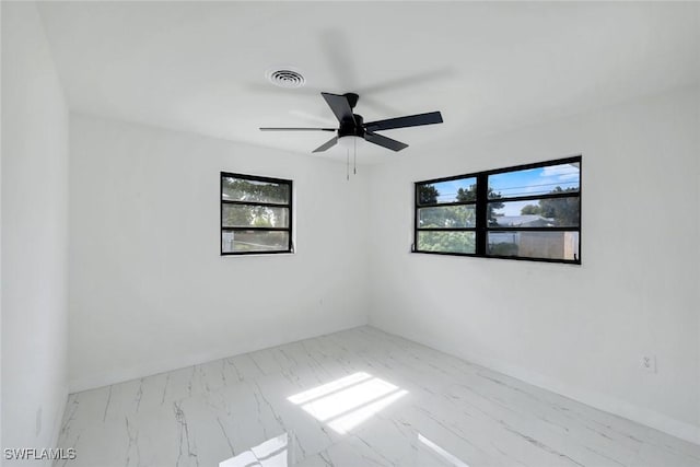 2118 Aldridge Ave, Fort Myers, FL 33907 - empty room with a ceiling fan and marble finish floors