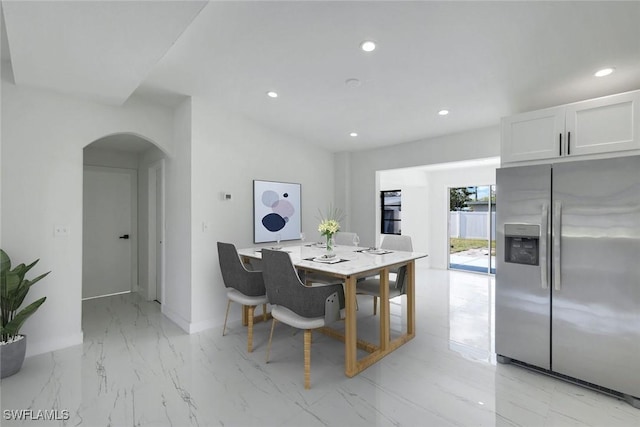 2118 Aldridge Ave, Fort Myers, FL 33907 - dining space with recessed lighting, light marble finish floors, and arched walkways