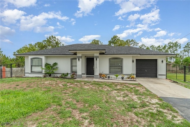 3430 35th Ave NE, Naples, FL 34120 - view of front of house featuring stucco siding, driveway, an attached garage, and a shingled roof