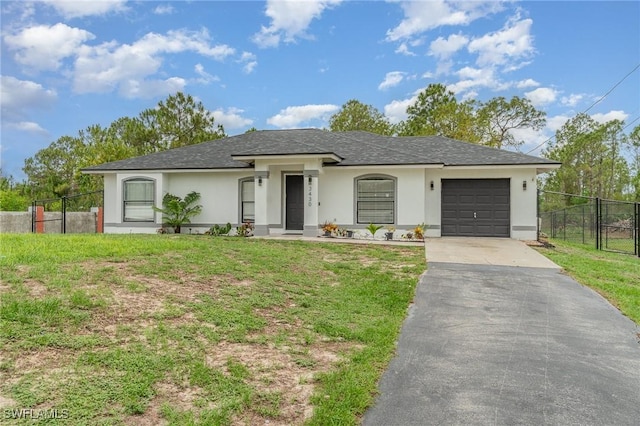3430 35th Ave NE, Naples, FL 34120 - view of front of property with stucco siding, asphalt driveway, a shingled roof, and a garage