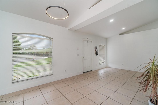 3430 35th Ave NE, Naples, FL 34120 - empty room featuring light tile patterned floors, lofted ceiling, and recessed lighting