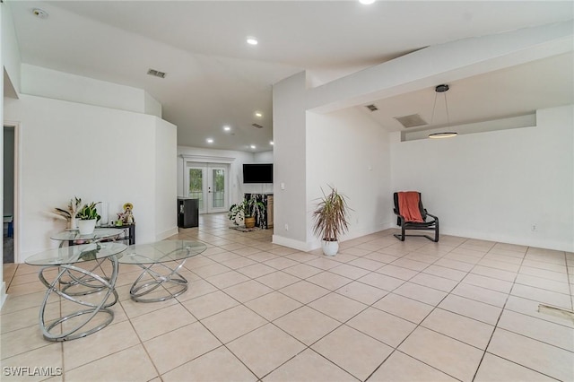 3430 35th Ave NE, Naples, FL 34120 - empty room featuring recessed lighting, light tile patterned floors, and french doors