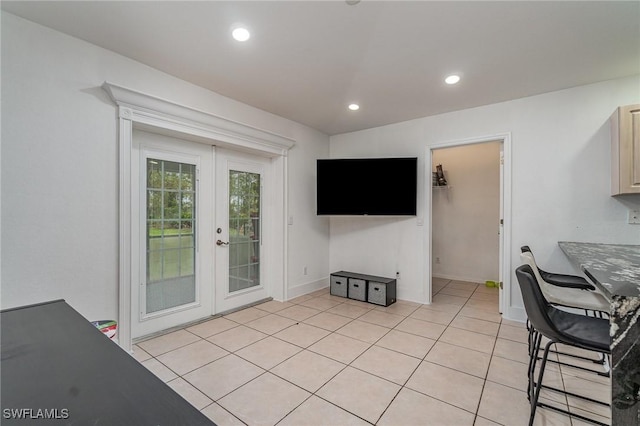 3430 35th Ave NE, Naples, FL 34120 - living room featuring french doors, recessed lighting, and light tile patterned flooring