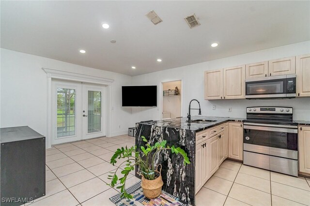3430 35th Ave NE, Naples, FL 34120 - kitchen with appliances with stainless steel finishes, light brown cabinetry, french doors, a peninsula, and light tile patterned floors