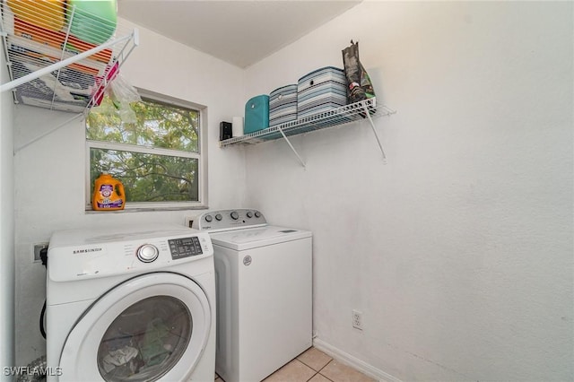 3430 35th Ave NE, Naples, FL 34120 - laundry room with washer and dryer and light tile patterned floors