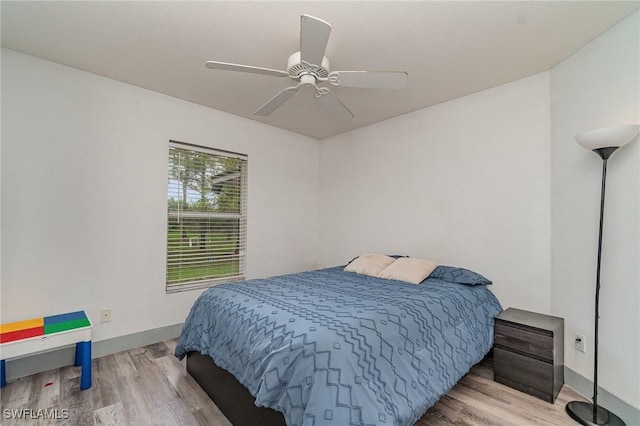 3430 35th Ave NE, Naples, FL 34120 - bedroom with wood finished floors and ceiling fan
