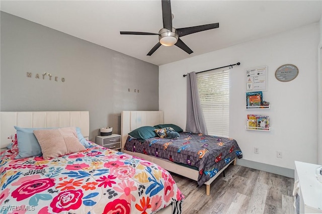 3430 35th Ave NE, Naples, FL 34120 - bedroom featuring wood finished floors and a ceiling fan